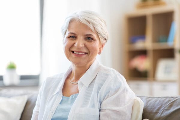 Life Insurance - portrait of happy senior woman laughing