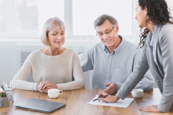 Insurance Broker: a group of people sitting at a table