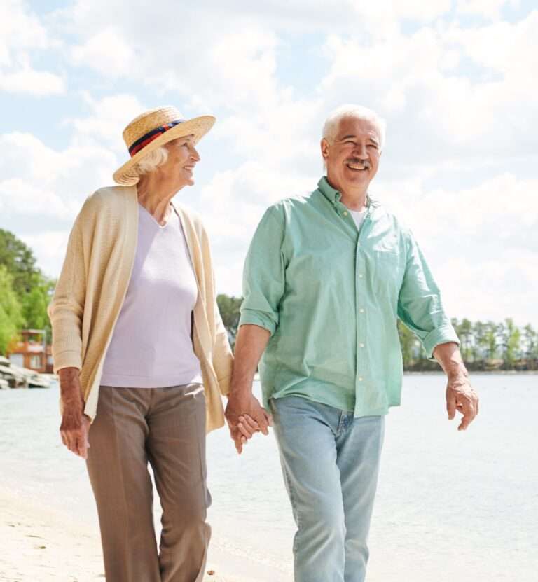 Sell Your Life Insurance Policy for Cash: a man and woman holding hands on a beach