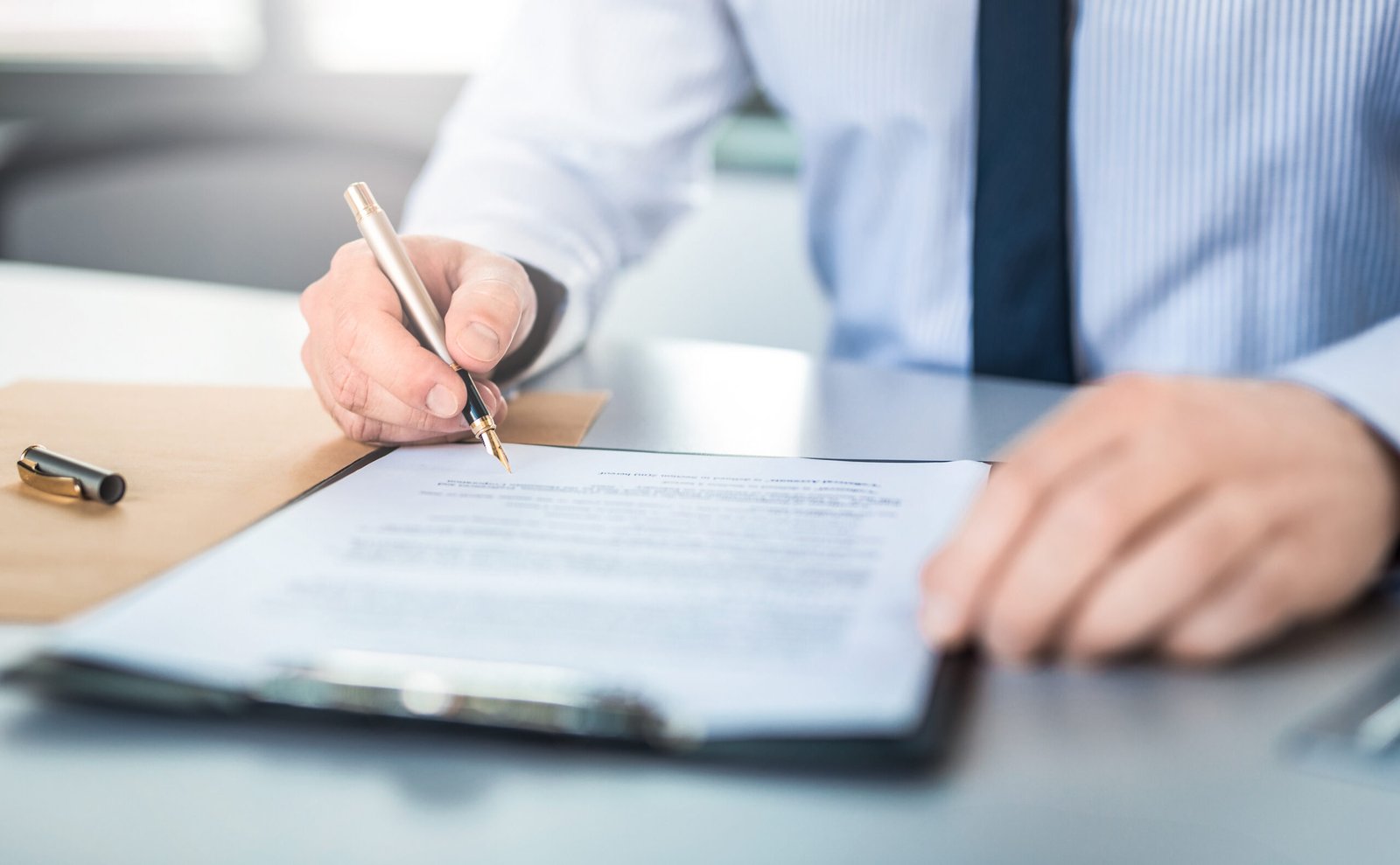 Key-person Insurance Policy - Business man signing contract.