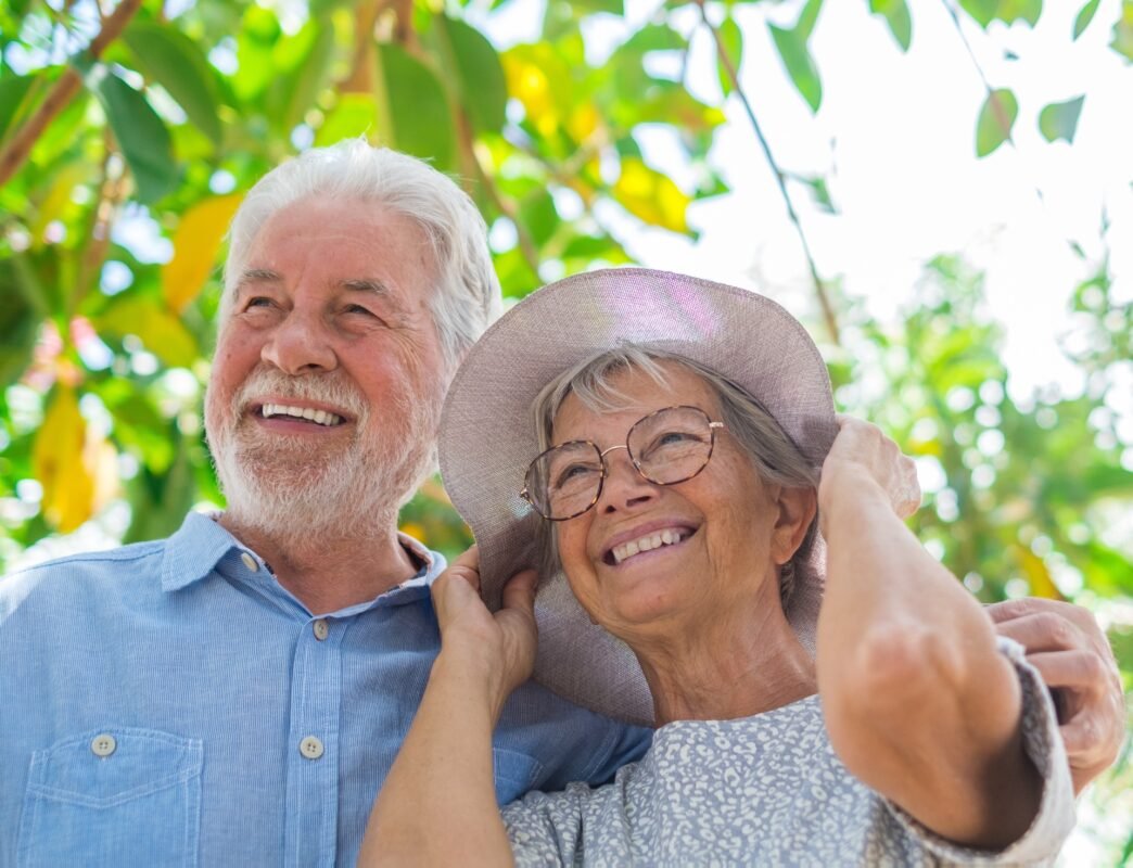 Can you cash out a term life insurance policy? - Elderly couple embracing in spring park outdoors having fun and enjoying together