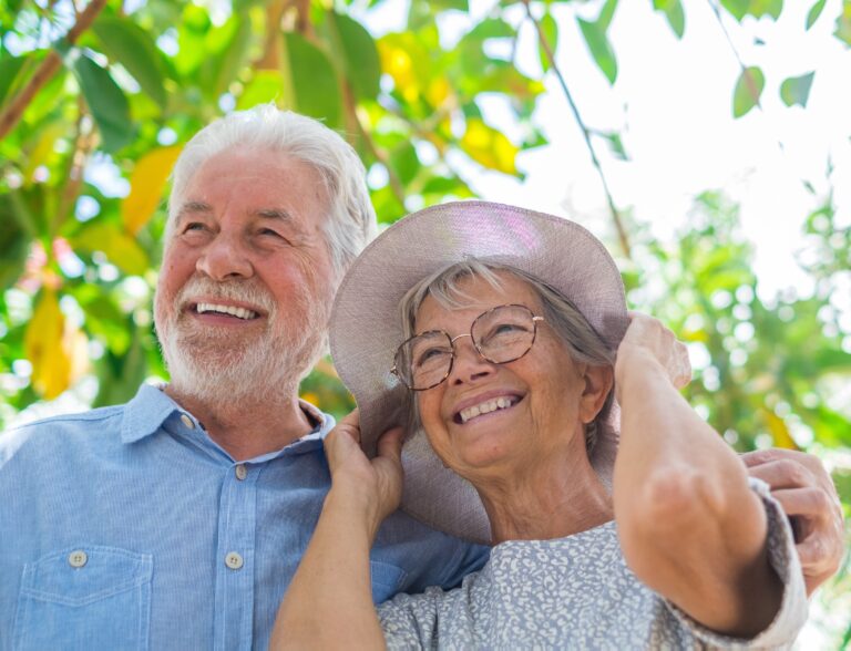 Can you cash out a term life insurance policy? - Elderly couple embracing in spring park outdoors having fun and enjoying together