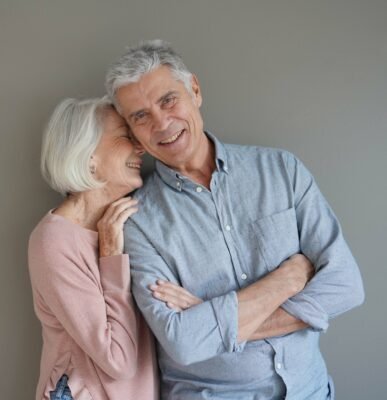Life Settlement vs Cash Surrender Value: happy senior couple smiling