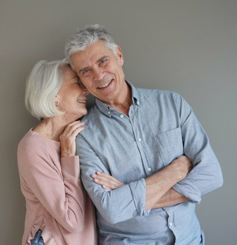 Life Settlement vs Cash Surrender Value: happy senior couple smiling