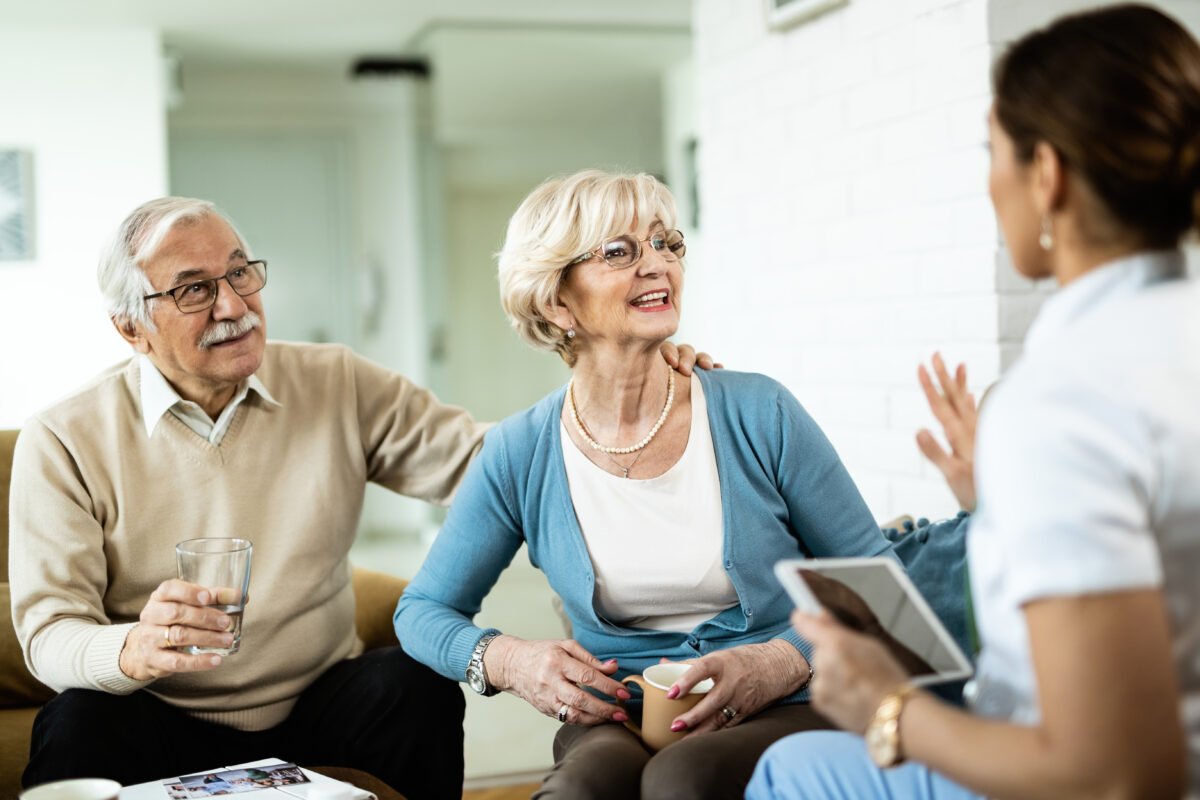 Can I sell My Life Insurance Policy: Happy senior woman and her husband communicating with woman