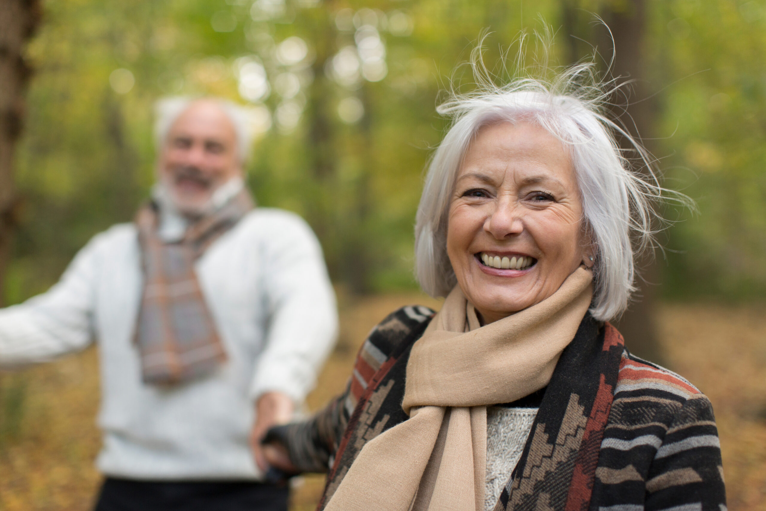 Cash Value Life Insurance: Portrait happy senior couple at park