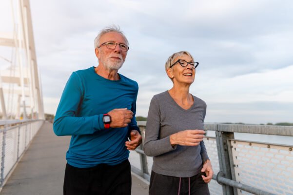 Can you sell a term life insurance policy? Happy senior couple go for jog.