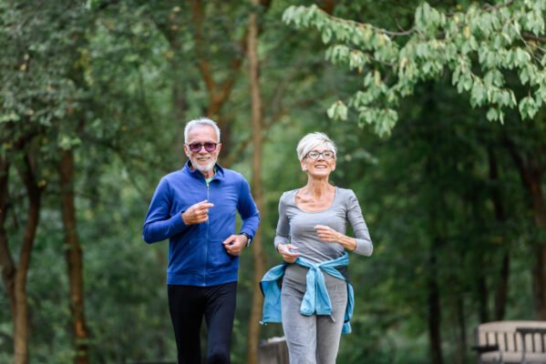 Can I Cash Out My Life Insurance Policy? - Active senior couple jogging in the park.