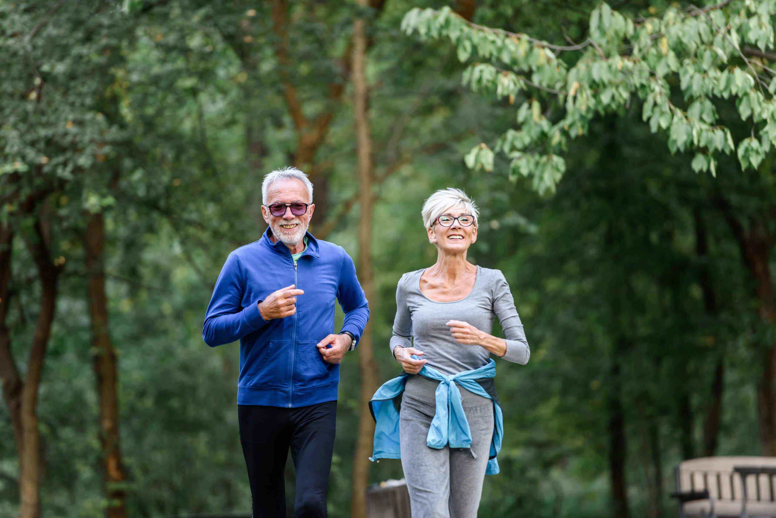 Can I Cash Out My Life Insurance Policy? - Active senior couple jogging in the park.