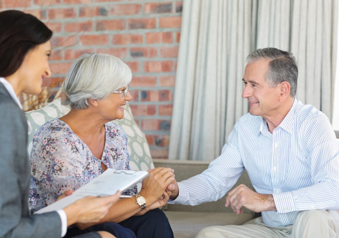 Life Settlement Broker talking to senior couple