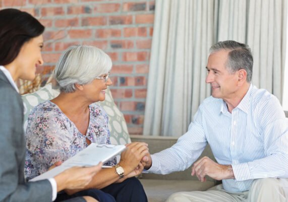Life Settlement Broker talking to senior couple