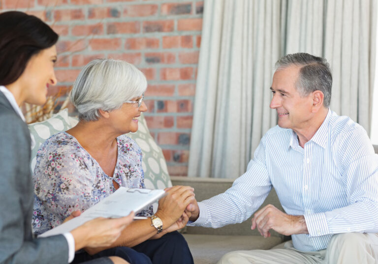 Life Settlement Broker talking to senior couple