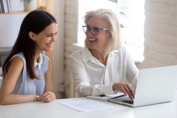 How to Find the Best Life Settlement Companies: happy mother and daughter on laptop