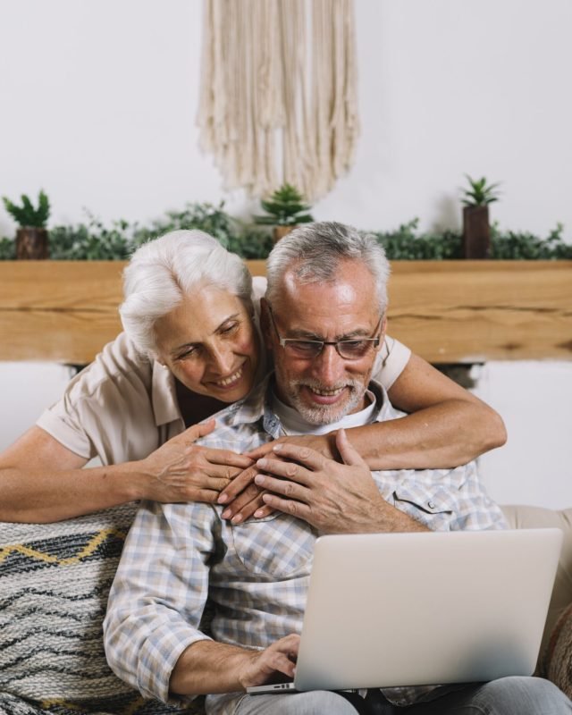 What is a viatical settlement? Happy senior couple on a laptop.