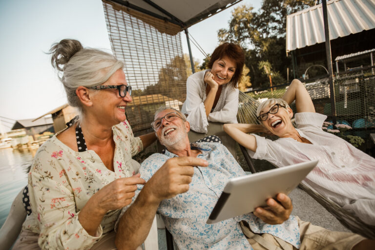Selling Your Life Insurance Policy: Group of senior friends having fun outdoors.