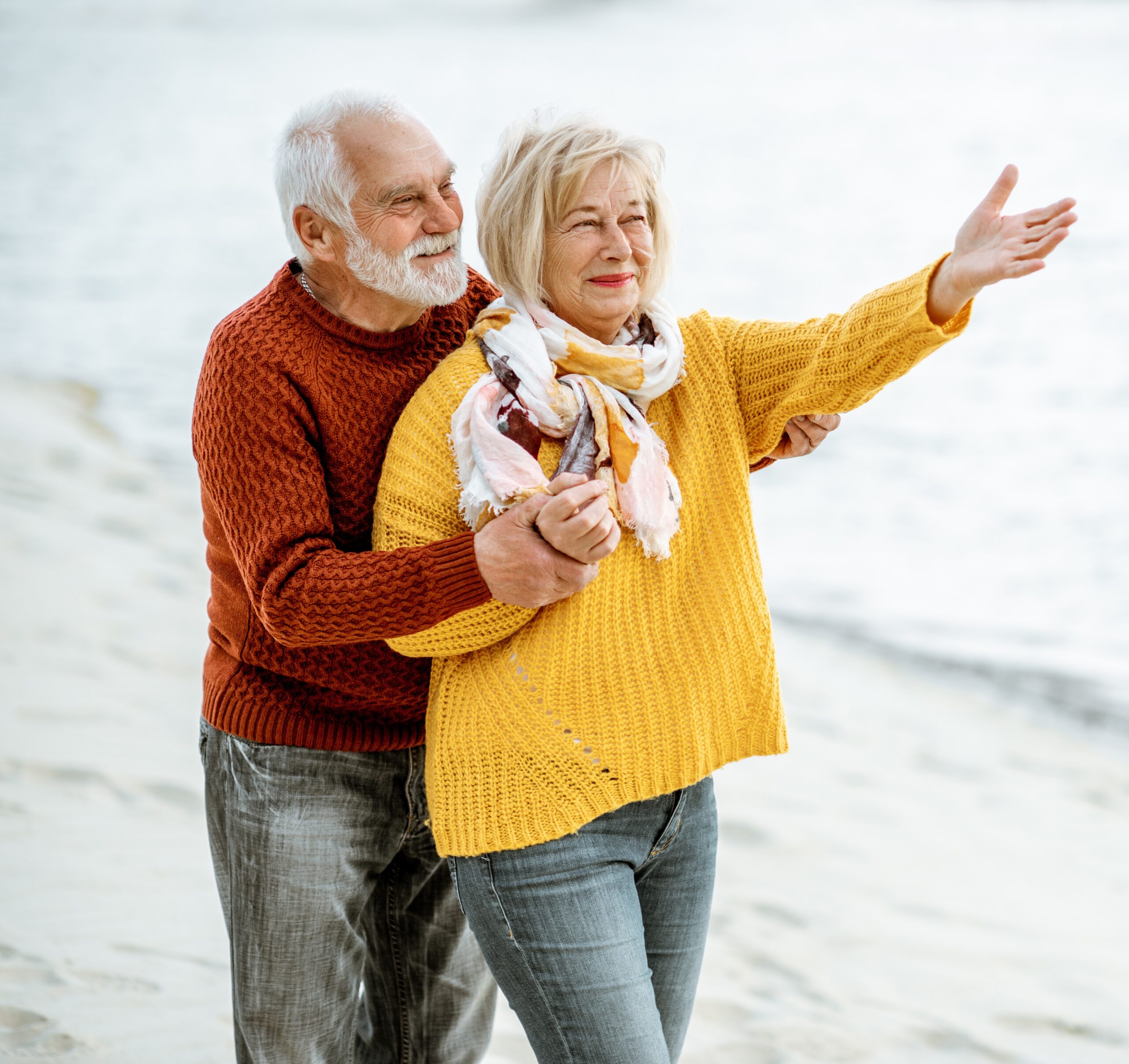 selling term life insurance - happy senior couple on the beach