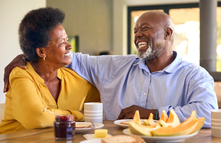 Can You Sell a Term Life Insurance Policy?: Senior Couple At Home Enjoying Breakfast Around Table Together