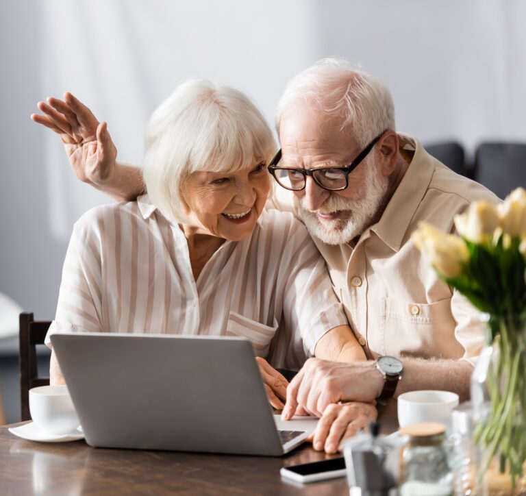 life insurance policy buyers: senior couple reviewing life settlement options